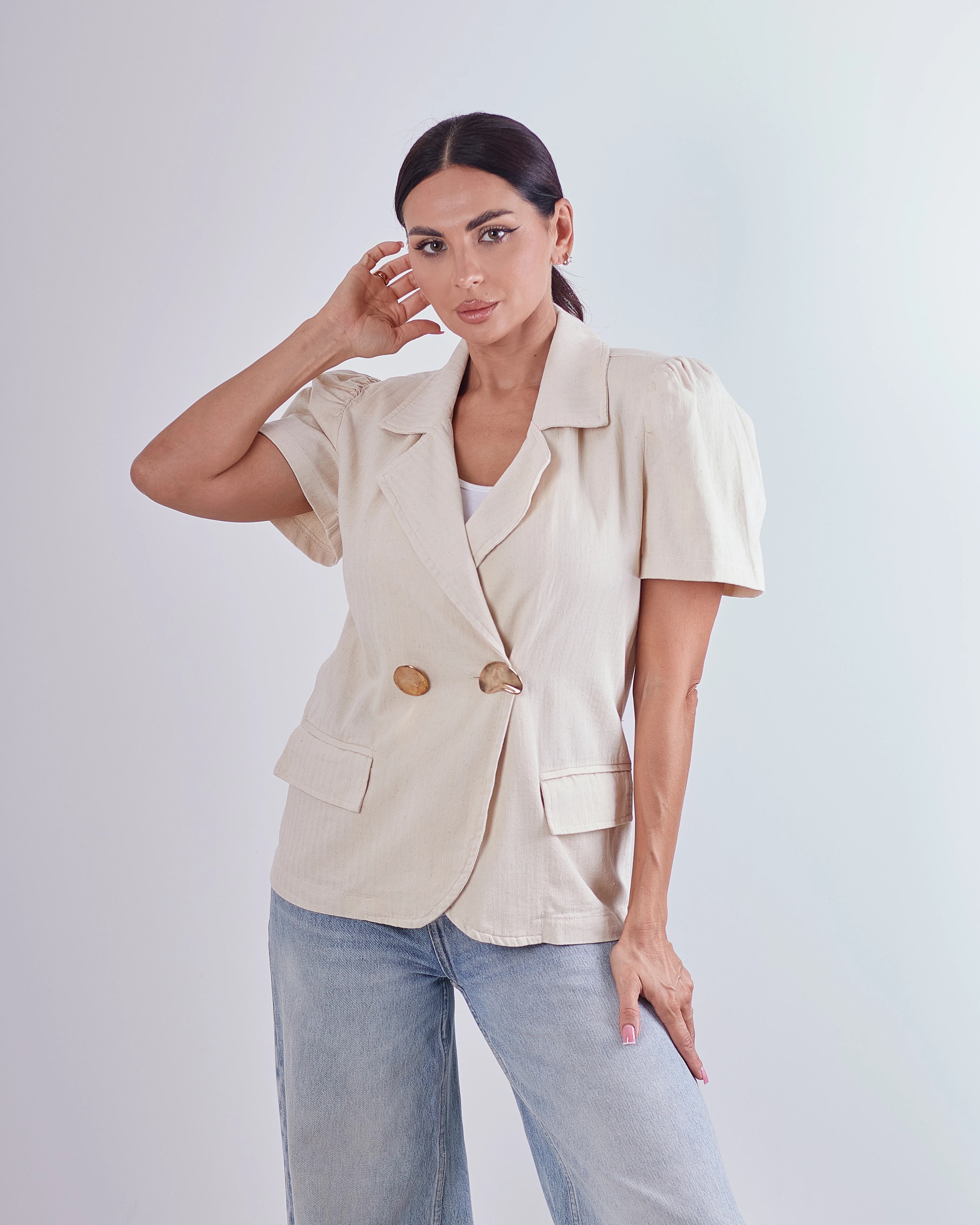 Off-white cover w/ gold buttons